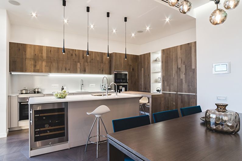 Conception d'une cuisine spacieuse dans le style du minimalisme - photo