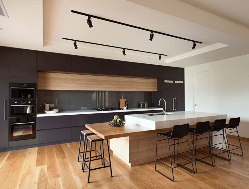 Conception d'une cuisine avec îlot dans le style du minimalisme - photo
