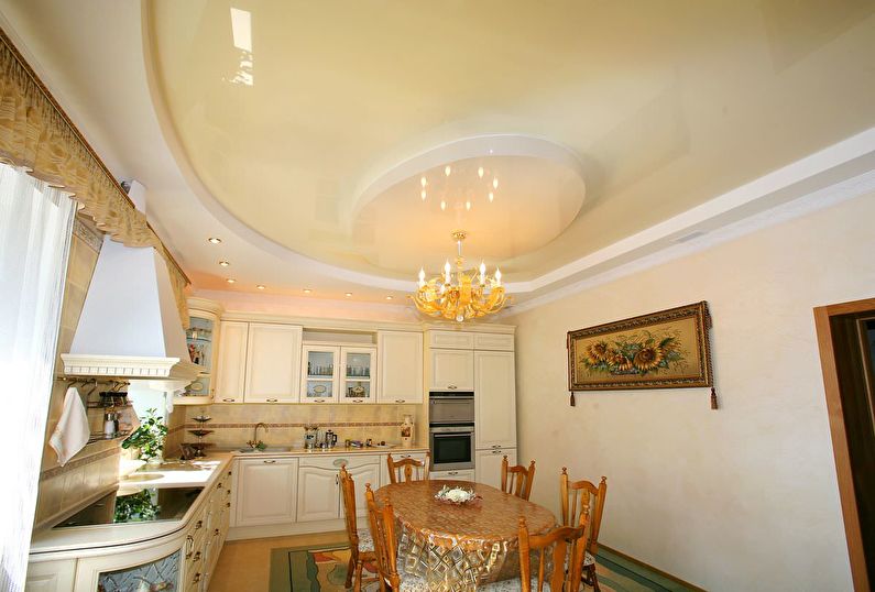 Beige glossy stretch ceiling in the kitchen - photo