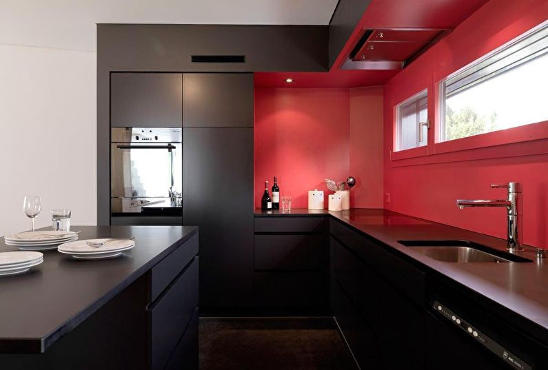 A combinação de cores no interior da cozinha - preto com vermelho