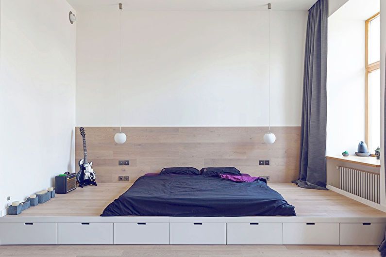 Design et soveværelse i en studiolejlighed