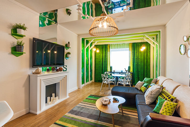 Green color in the interior of the living room - photo