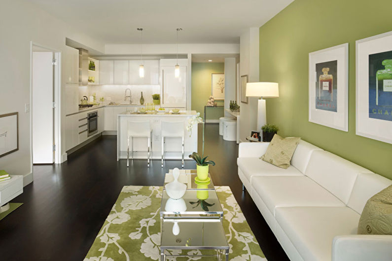 Green color in the interior of the living room - photo