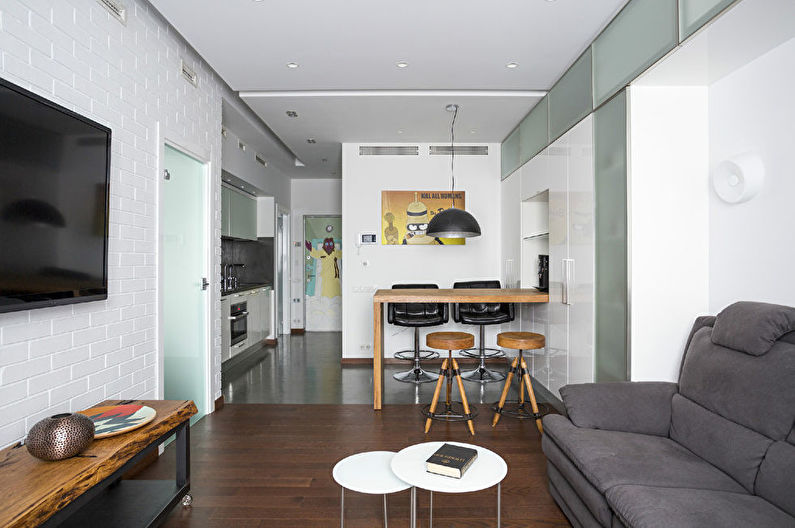 Virtuves-viesistabas interjera dizains baltā krāsā - foto