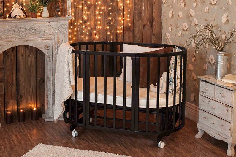 Zīdaiņu bērnu gultiņu veidi pēc dizaina - gulta uz riteņiem