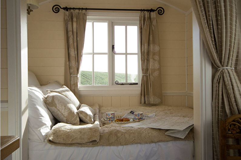 Inredning av ett vardagsrum kombinerat med ett sovrum - foto