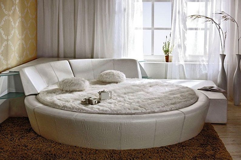 Types of round beds in the bedroom - Bed with headboard and sides