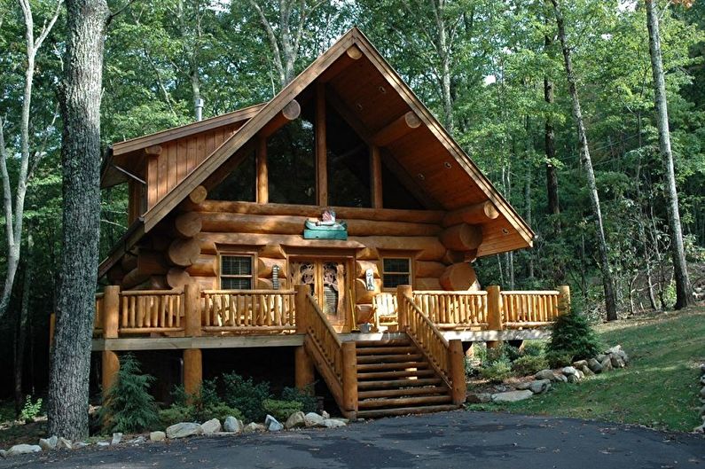Модерни дизайни на къщи от дървен материал - Ловният дом от заобления дървен труп