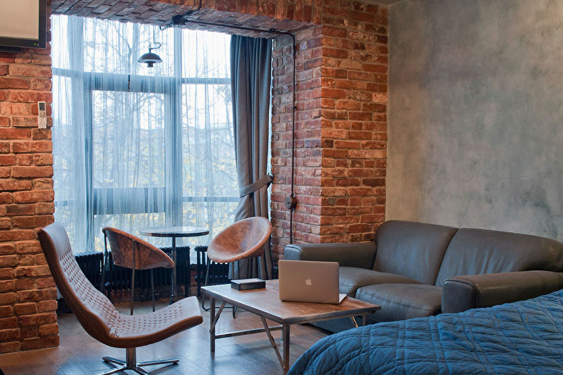 Dizajn enterijera dnevne sobe u stilu loft - fotografija