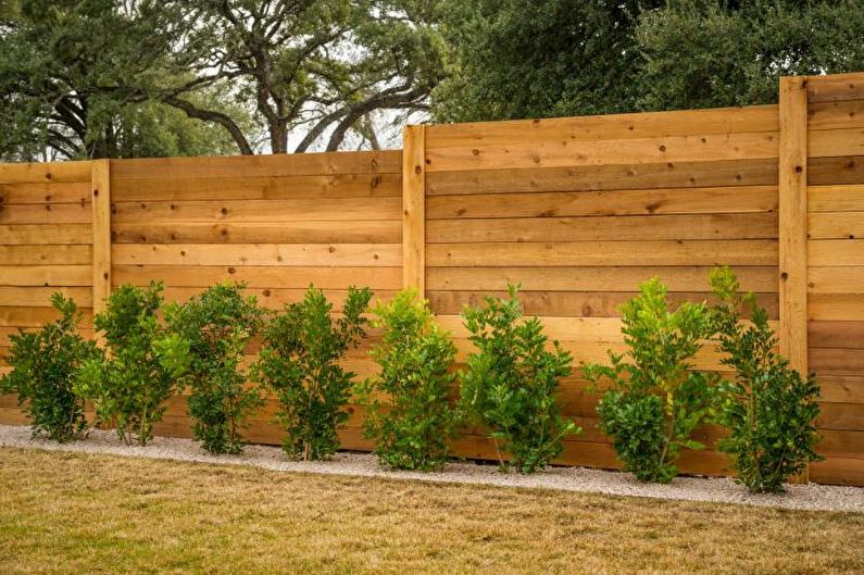 Wooden fences for a private house - photo